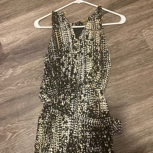 It’s a Jumpsuit had gold chains deep black color